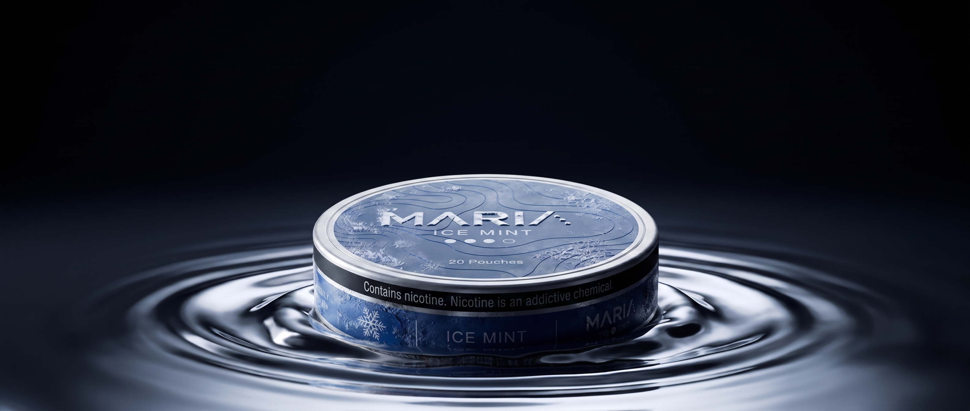 A MARIA Ice Mint can resting in a rippling pool of liquid chrome, dark studio background